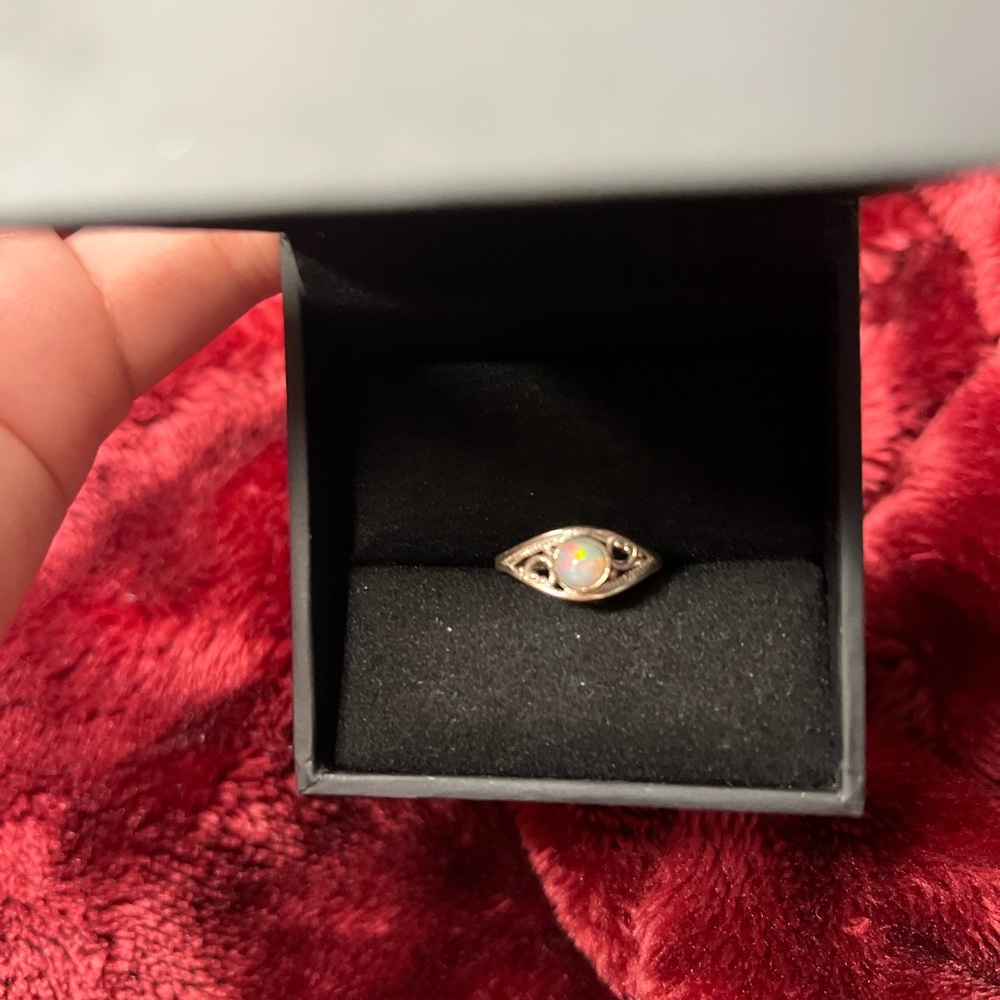 Beautiful vintage white/green opal with red orange , yellow, and green fire